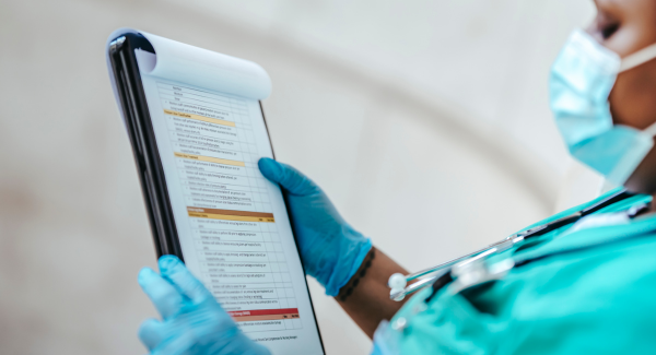 Image of a medical professional holding a patient chart