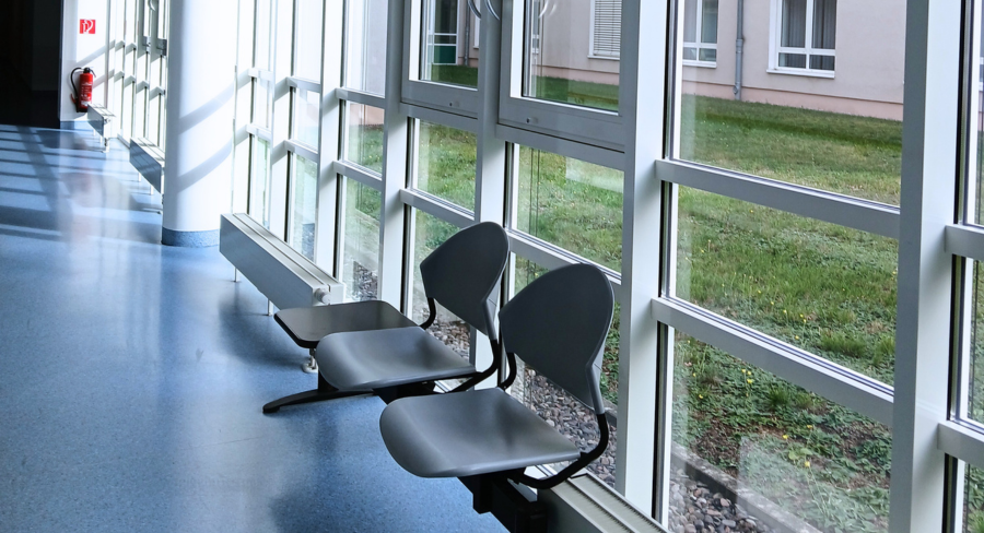 image of two empty seats in a hallway